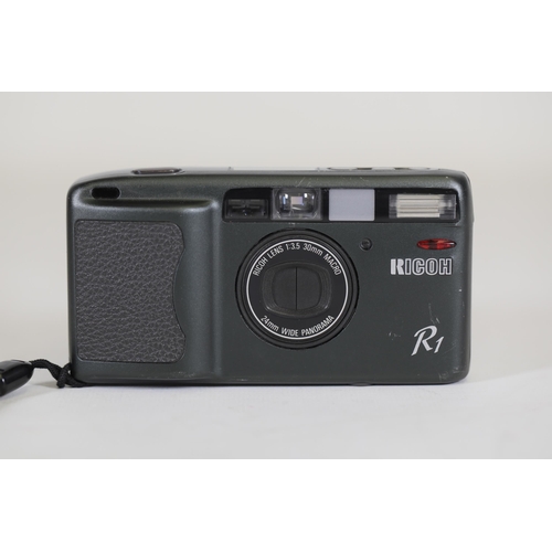 2 - Ricoh R1 35mm Compact Camera - Untested, Ideal for Parts - Note on Back with Camera Issues

This is ... 