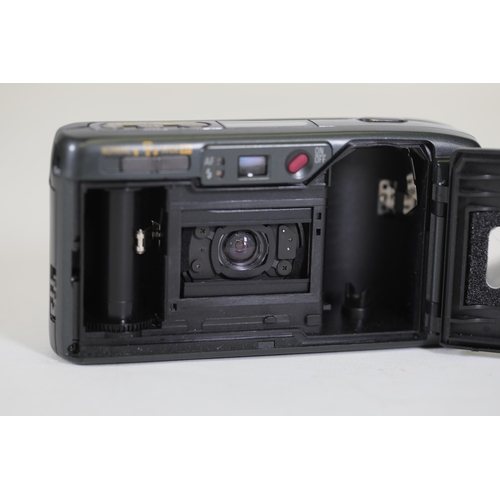 2 - Ricoh R1 35mm Compact Camera - Untested, Ideal for Parts - Note on Back with Camera Issues

This is ... 