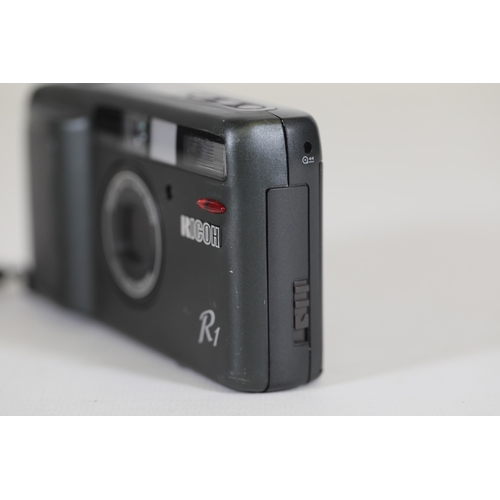 2 - Ricoh R1 35mm Compact Camera - Untested, Ideal for Parts - Note on Back with Camera Issues

This is ... 