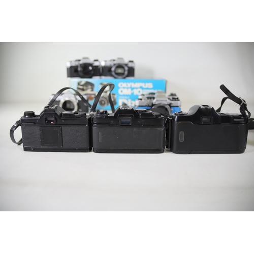 26 - 12 Mixed Lot of Olympus Vintage Film Cameras - OM Series

- 7x Olympus OM-10 (Black and Alloy)
- 1x ... 