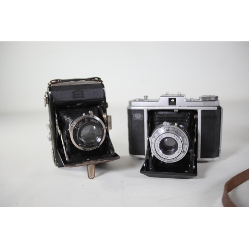 33 - 8 vintage folding cameras various zeiss ikon makes.  All of these cameras are being sold as untested... 