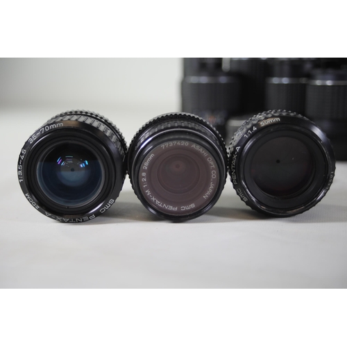 41 - Large Collection of 14 Pentax and Praktica Lenses:

1. Praktica 3.5/135 MC Carl Zeiss Jena: Lens loo... 