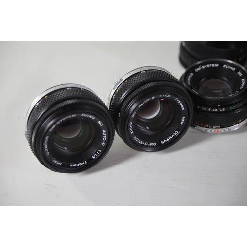 42 - Collection of 10 various Olympus Zuiko camera lenses mostly from the Om-system. The lenses are as fo... 