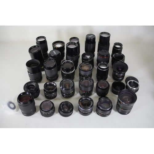 44 - Collection of 31 Camera Lenses:

1. Rolleinar-MC 135mm Lens - Clear optics with some internal dust n... 