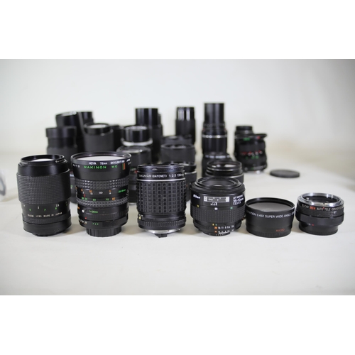 44 - Collection of 31 Camera Lenses:

1. Rolleinar-MC 135mm Lens - Clear optics with some internal dust n... 