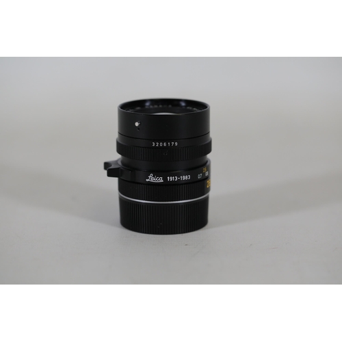 50 - A Leica Elmarit-M 28mm f2.8 Lens, 1913-1983 edition, serial number 3206179