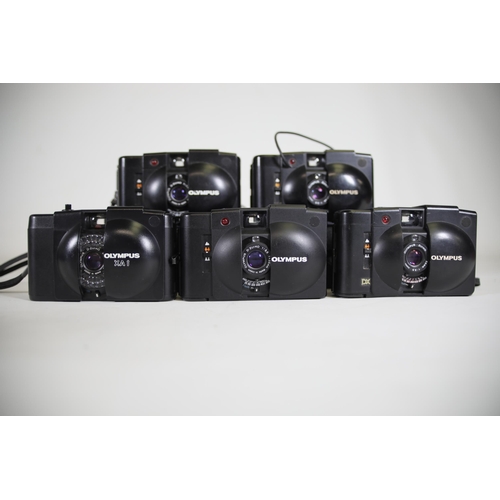 6 - Olympus Compact Cameras:

1. Olympus XA1 - Good Condition:
- The camera is in good condition.
- Unte... 