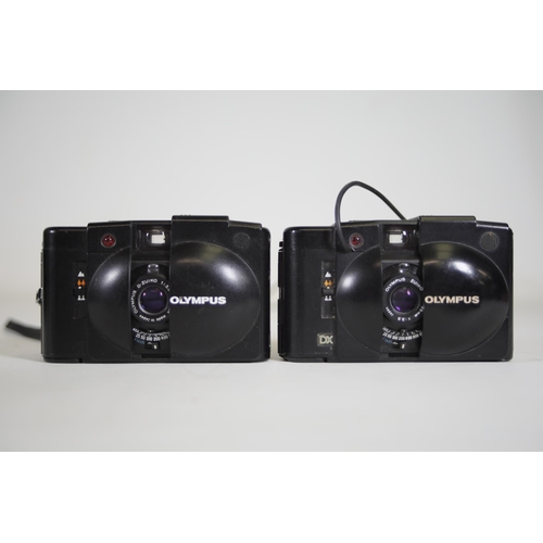 6 - Olympus Compact Cameras:

1. Olympus XA1 - Good Condition:
- The camera is in good condition.
- Unte... 