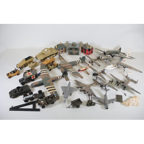 77 - Collection of Scale Model Planes, Army Vehicles, and Houses

Large collection of various scale model... 