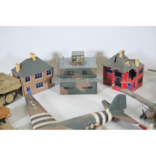 77 - Collection of Scale Model Planes, Army Vehicles, and Houses

Large collection of various scale model... 