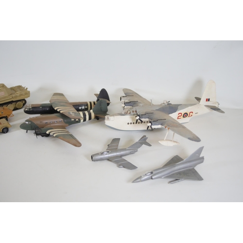 77 - Collection of Scale Model Planes, Army Vehicles, and Houses

Large collection of various scale model... 