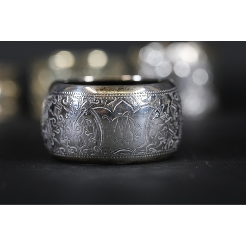 94 - 5 Silver Hallmarked Napkin Rings and 1 Other - The set includes 5 silver napkin rings weighing a tot... 