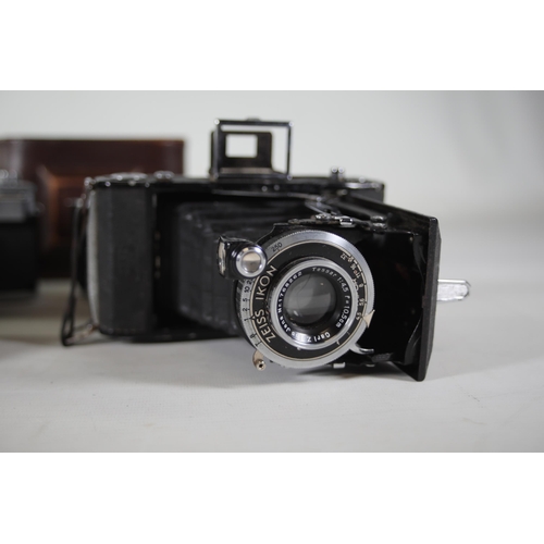 1 - **Collection of Vintage Folding and Rangefinder Cameras Including Zeiss Ikon and Agfa Models**  This... 