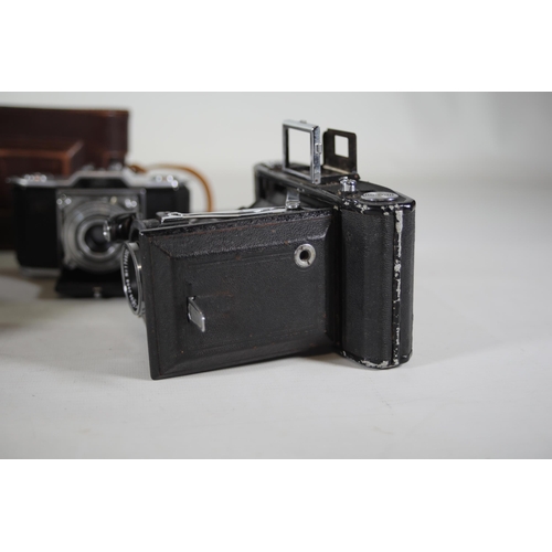 1 - **Collection of Vintage Folding and Rangefinder Cameras Including Zeiss Ikon and Agfa Models**  This... 