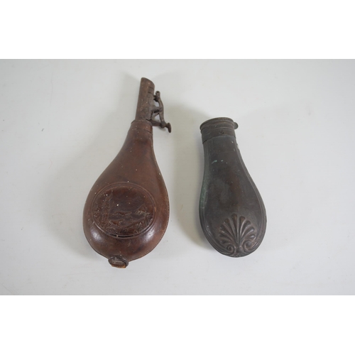 28 - **Pair of Antique Gunpowder Horn Flasks: Leather by Dixon & Sons and Metal by Sykes**  This distingu... 