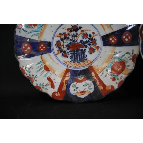 30 - Pair of 18th-Century Chinese Export Imari Porcelain Plates with Floral Motifs  This offering compris... 