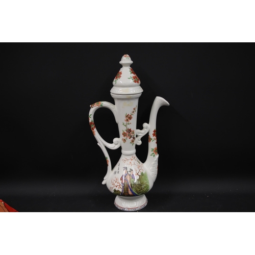 32 - Antique Porcelain Ewer with Chinese Pattern  This exquisite antique porcelain ewer, standing 19.5 in... 