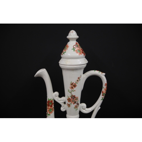 32 - Antique Porcelain Ewer with Chinese Pattern  This exquisite antique porcelain ewer, standing 19.5 in... 