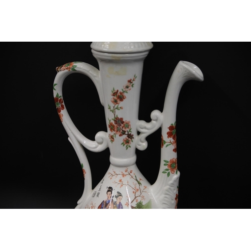 32 - Antique Porcelain Ewer with Chinese Pattern  This exquisite antique porcelain ewer, standing 19.5 in... 