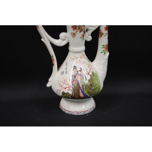 32 - Antique Porcelain Ewer with Chinese Pattern  This exquisite antique porcelain ewer, standing 19.5 in... 