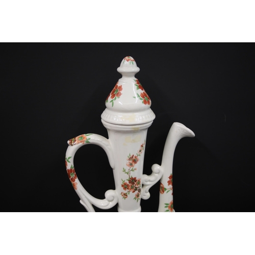 32 - Antique Porcelain Ewer with Chinese Pattern  This exquisite antique porcelain ewer, standing 19.5 in... 