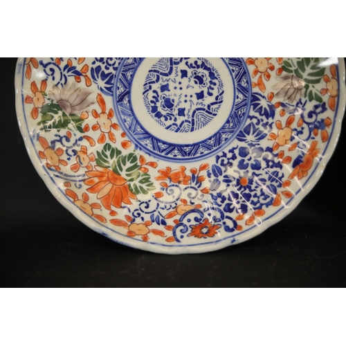 38 - Pair of Imari Dinner Plates  This exquisite pair of Imari dinner plates feature elaborate floral and... 