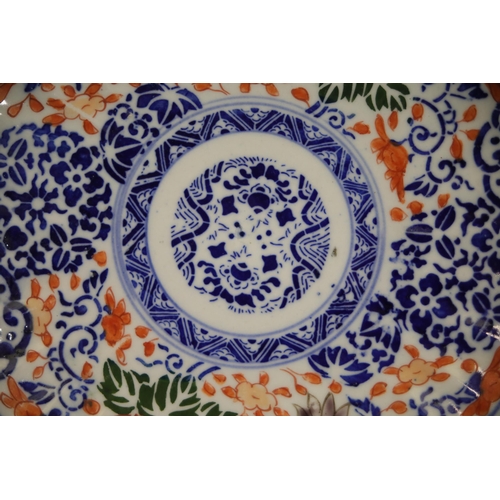 38 - Pair of Imari Dinner Plates  This exquisite pair of Imari dinner plates feature elaborate floral and... 