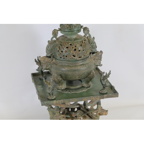 42 - Archaic Bronze Chinese Incense Burner with Intricate Animal Decorations  This exquisite example of a... 