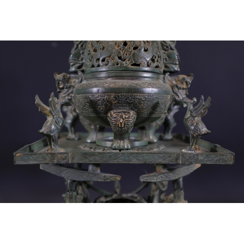 42 - Archaic Bronze Chinese Incense Burner with Intricate Animal Decorations  This exquisite example of a... 