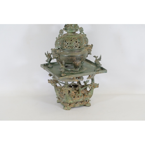 42 - Archaic Bronze Chinese Incense Burner with Intricate Animal Decorations  This exquisite example of a... 