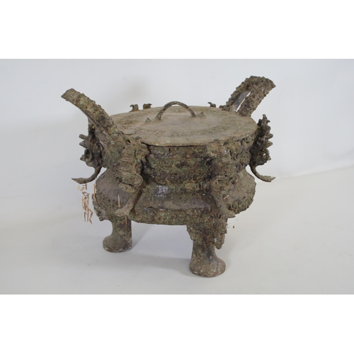 43 - Archaic Bronze Chinese Ding Vessel  This exquisite archaic bronze Chinese ding vessel is a testament... 