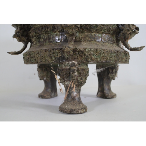 43 - Archaic Bronze Chinese Ding Vessel  This exquisite archaic bronze Chinese ding vessel is a testament... 