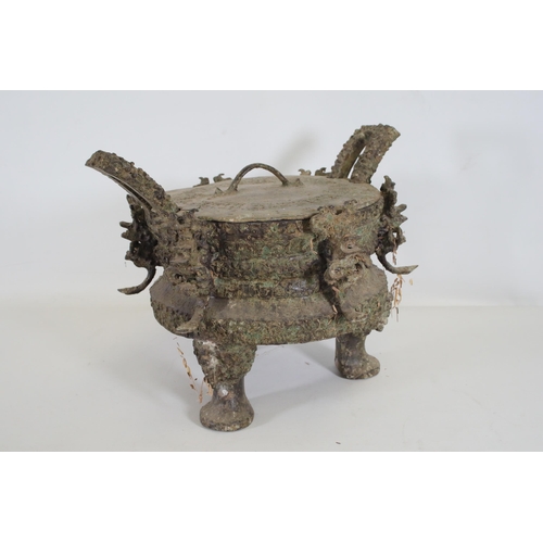 43 - Archaic Bronze Chinese Ding Vessel  This exquisite archaic bronze Chinese ding vessel is a testament... 