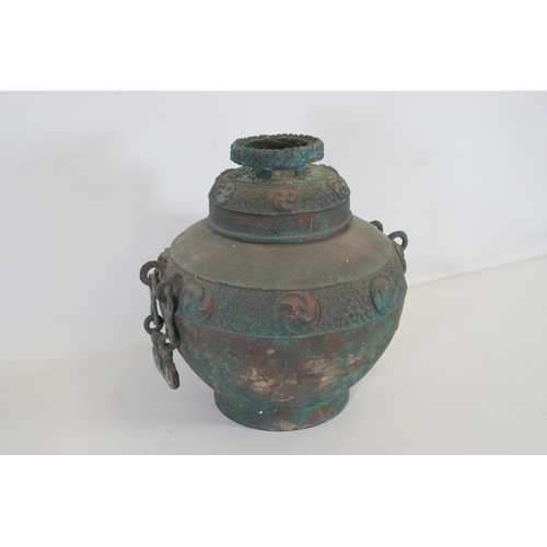 44 - Archaic Bronze Chinese Wall Hanging Wine Pot  This archaic bronze wine pot from China is a remarkabl... 