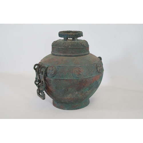 44 - Archaic Bronze Chinese Wall Hanging Wine Pot  This archaic bronze wine pot from China is a remarkabl... 