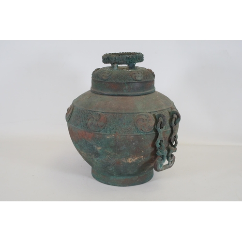 44 - Archaic Bronze Chinese Wall Hanging Wine Pot  This archaic bronze wine pot from China is a remarkabl... 