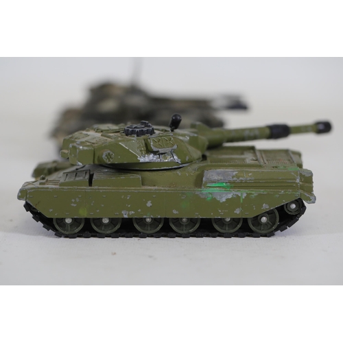 51 - Collection of 8 Diecast Toy Tanks by Dinky Toys and Corgi  This impressive collection features eight... 