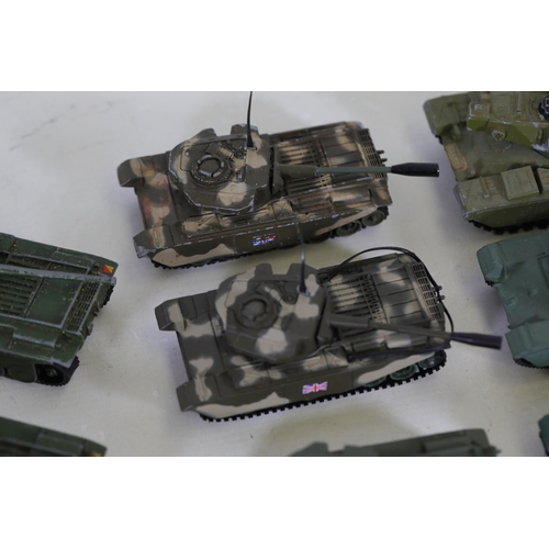 51 - Collection of 8 Diecast Toy Tanks by Dinky Toys and Corgi  This impressive collection features eight... 