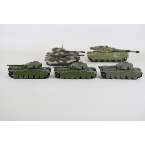 51 - Collection of 8 Diecast Toy Tanks by Dinky Toys and Corgi  This impressive collection features eight... 