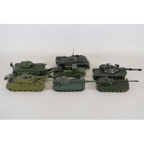 55 - **Collection of Seven Miniature Military Vehicles by Corgi and Dinky Toys**  This collection feature... 