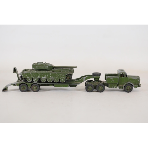 55 - **Collection of Seven Miniature Military Vehicles by Corgi and Dinky Toys**  This collection feature... 