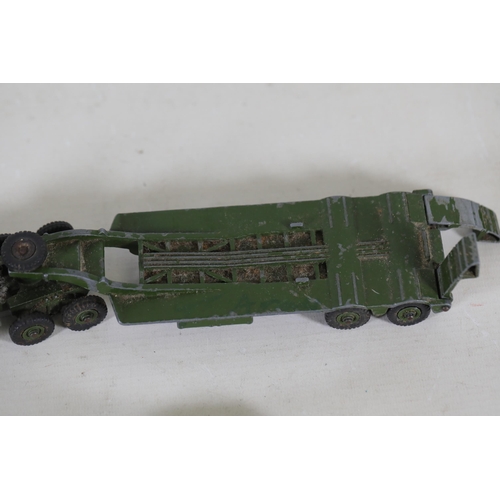 55 - **Collection of Seven Miniature Military Vehicles by Corgi and Dinky Toys**  This collection feature... 