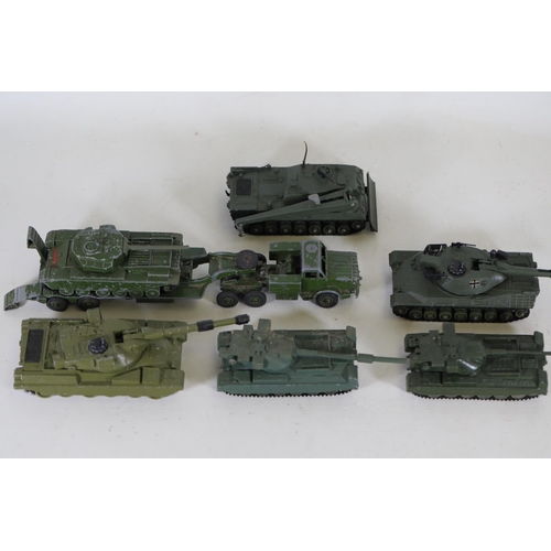 55 - **Collection of Seven Miniature Military Vehicles by Corgi and Dinky Toys**  This collection feature... 