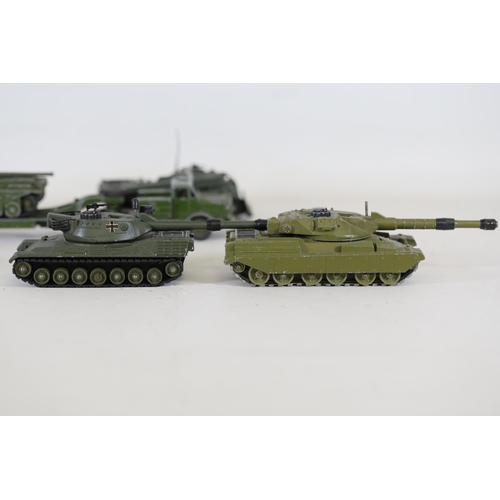 55 - **Collection of Seven Miniature Military Vehicles by Corgi and Dinky Toys**  This collection feature... 