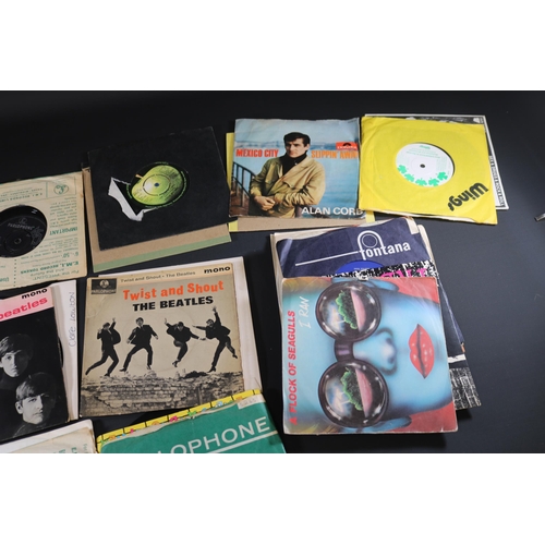 60 - Collection of Vinyl Singles, approximately 35 in total,mostly with covers, some loose, varying condi... 