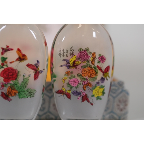 73 - **Set of Four 20th-Century Chinese Reverse-Painted Scent Bottles in Decorative Case**  This elegant ... 