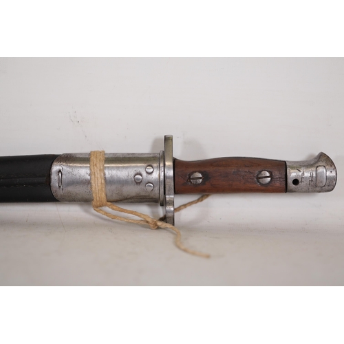 855 - 1907 Lee-Enfield Bayonet with Leather Scabbard  This 1907 Lee-Enfield bayonet, measuring 22.5 inches... 