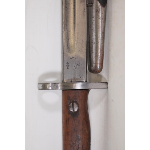 855 - 1907 Lee-Enfield Bayonet with Leather Scabbard  This 1907 Lee-Enfield bayonet, measuring 22.5 inches... 