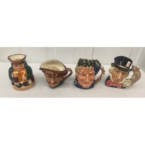 73 - Three Royal Doulton Character jugs and one Toby Jug, to include Mad Hatter, Bacchus (4)