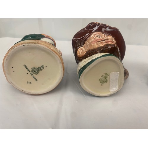 73 - Three Royal Doulton Character jugs and one Toby Jug, to include Mad Hatter, Bacchus (4)